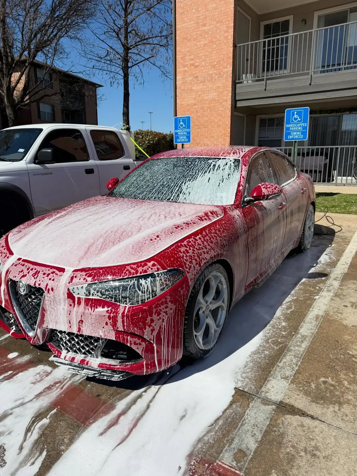 Alfa Romeo covered in foam during a mobile wash