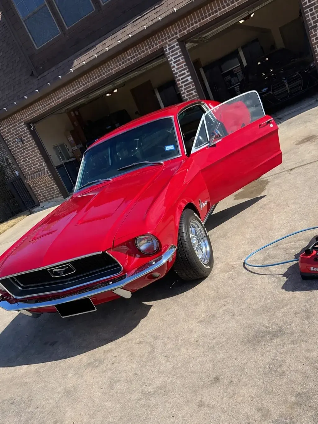 Red Mustang detailed to a mirror shine